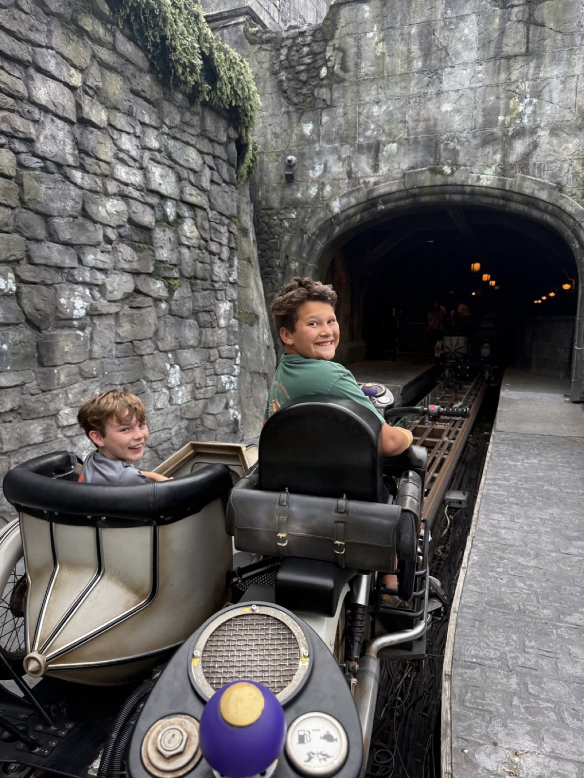 Two boys riding Hagrid's motorbike at Universal Orlando