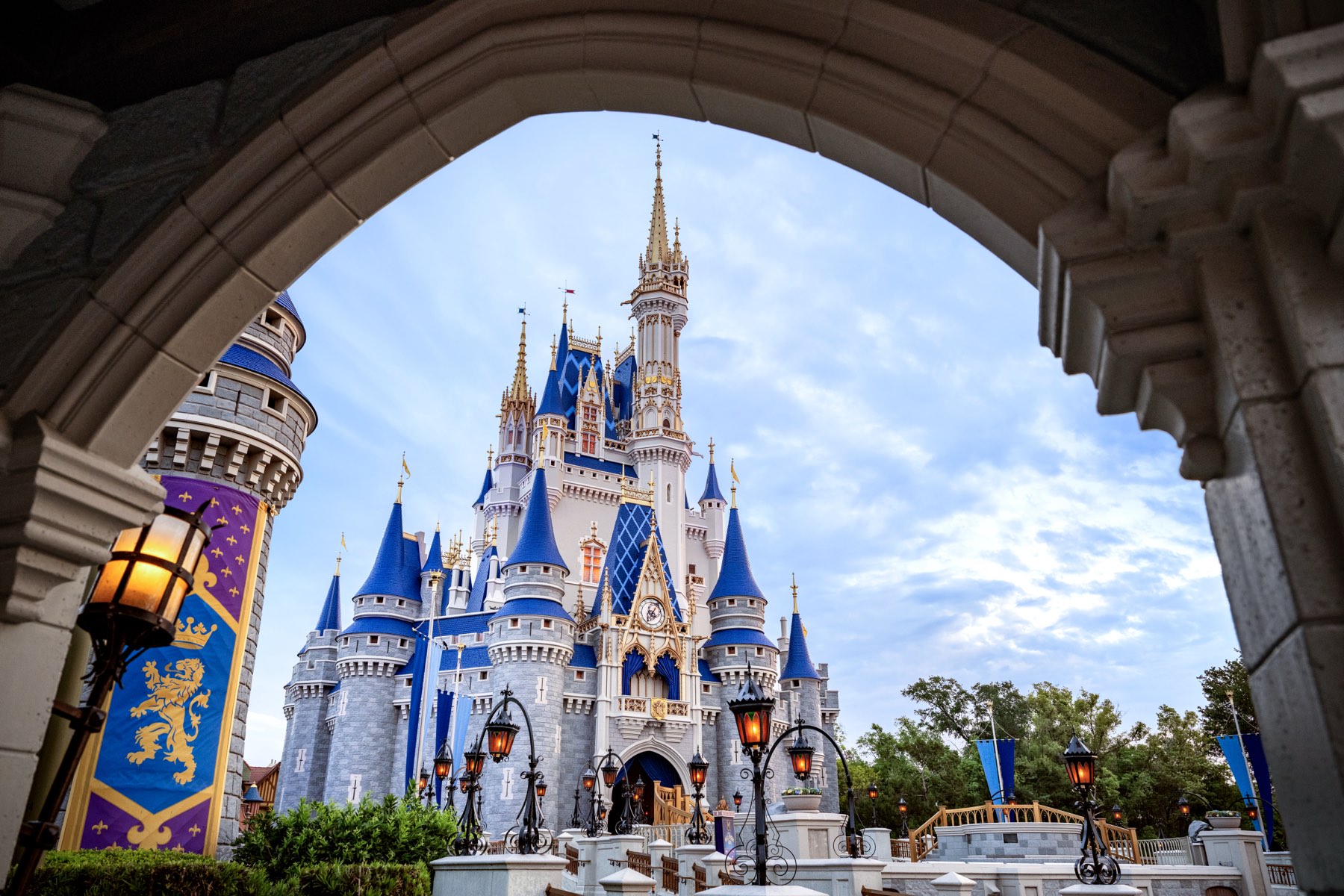 Cinderella Castle seen through a stone archway