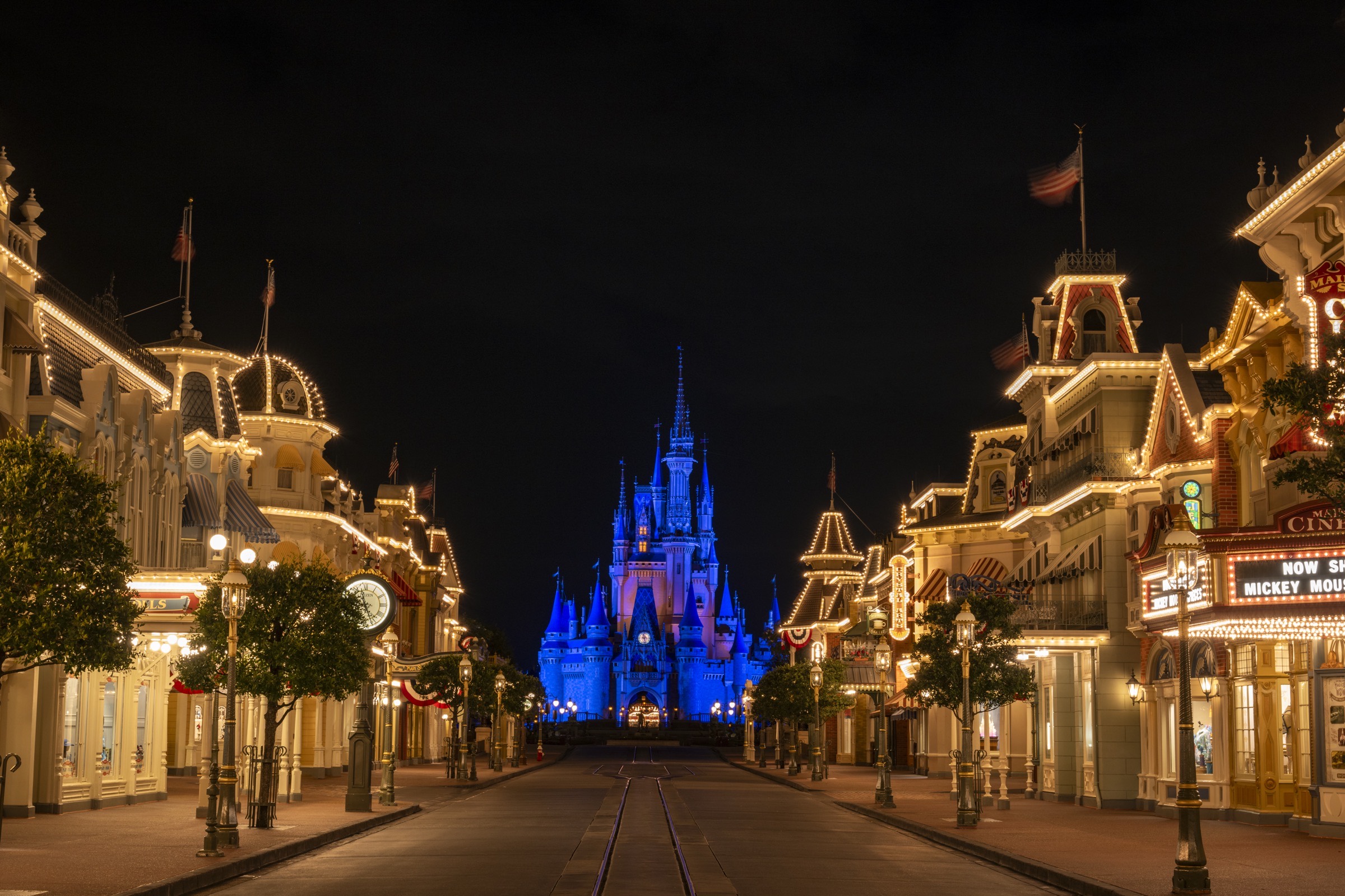Main Street, U.S.A. lit at night and empty, looking toward Cinderella Castle