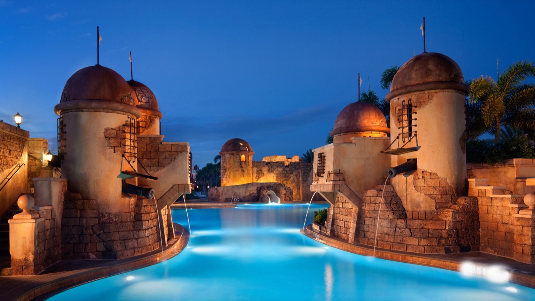 The fort themed pool at Disney's Caribbean Beach Resort at dusk