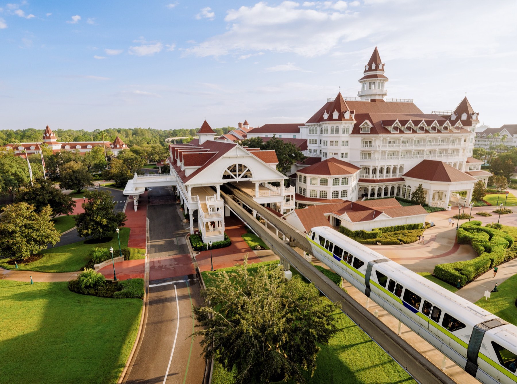 Disney's Grand Floridian Resort & Spa from above, with the monorail gliding past