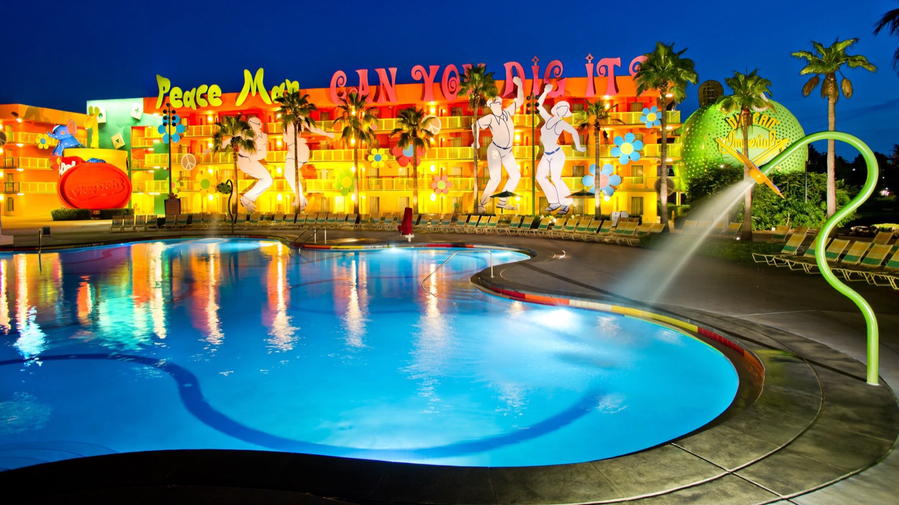 The Hippy Dippy Pool at Disney's Pop Century Resort lit up at night