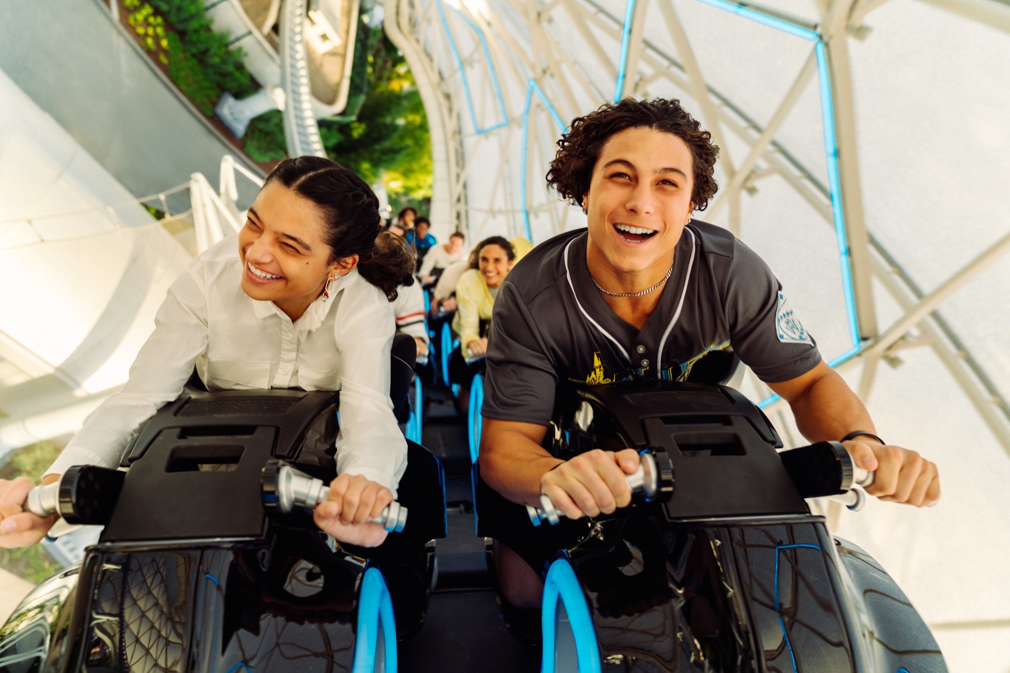 Two riders leaning into the launch on TRON Lightcycle / Run