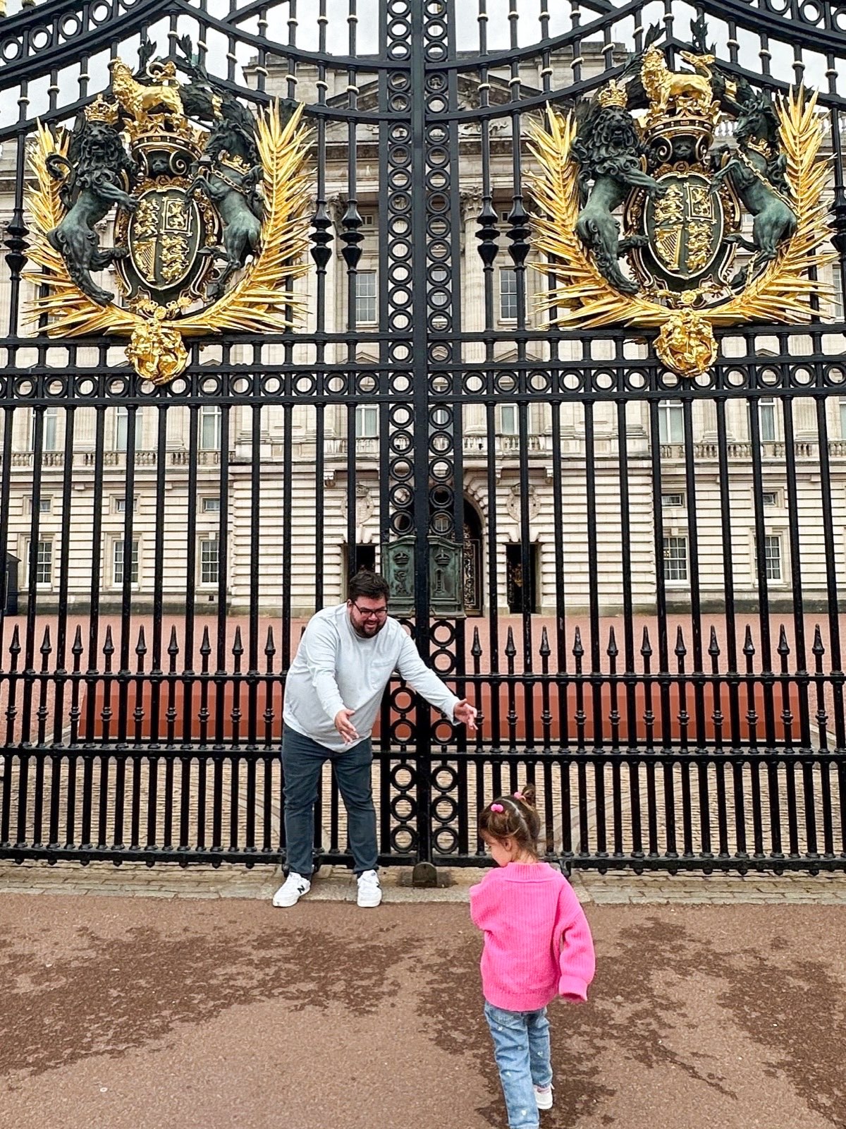 Rob at the gates of Buckingham Palace, London
